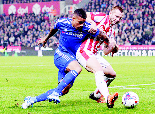 Stoke City’s English-born Scottish defender Phil Bardsley (right), vies against Chelsea’s Brazilian striker Kenedy during the English League Cup fourth round football match between Stoke City and Chelsea at the Britannia Stadium in Stoke-on-Trent, central England on Oct 27. (AFP)