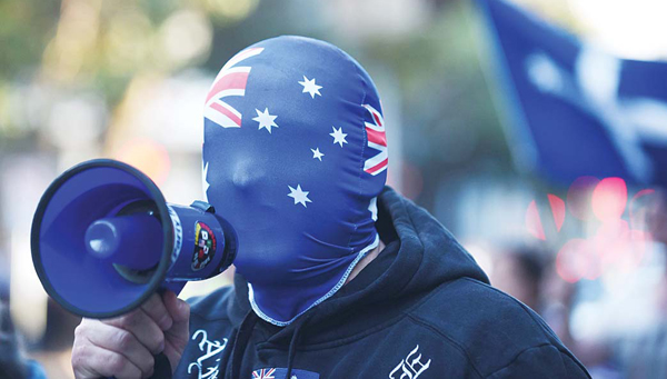 An anti-Muslim protester shouts slogans outside the Parramatta Mosque in Sydney