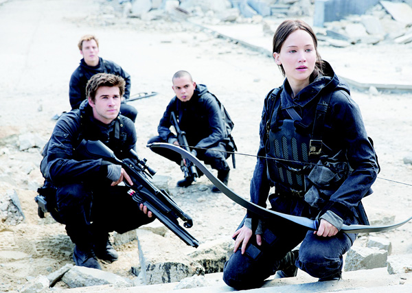 This image released by Lionsgate shows (from left), Liam Hemsworth as Gale Hawthorne, Sam Claflin as Finnick Odair, Evan Ross as Messalla and Jennifer Lawrence as Katniss Everdeen in a scene from ‘The Hunger Games: Mockingjay Part 2,’ ‘Hunger Games’ tops ‘Good Dinosaur’, ‘Creed’ heading into Thanksgiving. (AP)