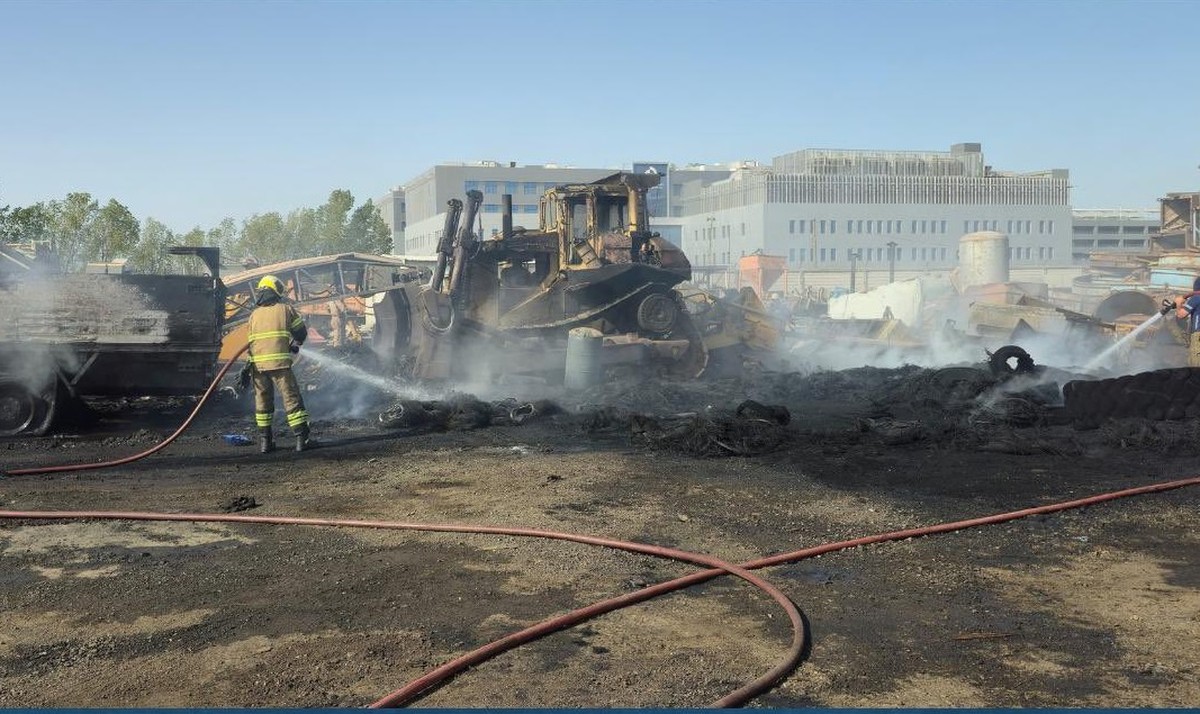 Firefighting teams contain fire at the Amghara scrapyard