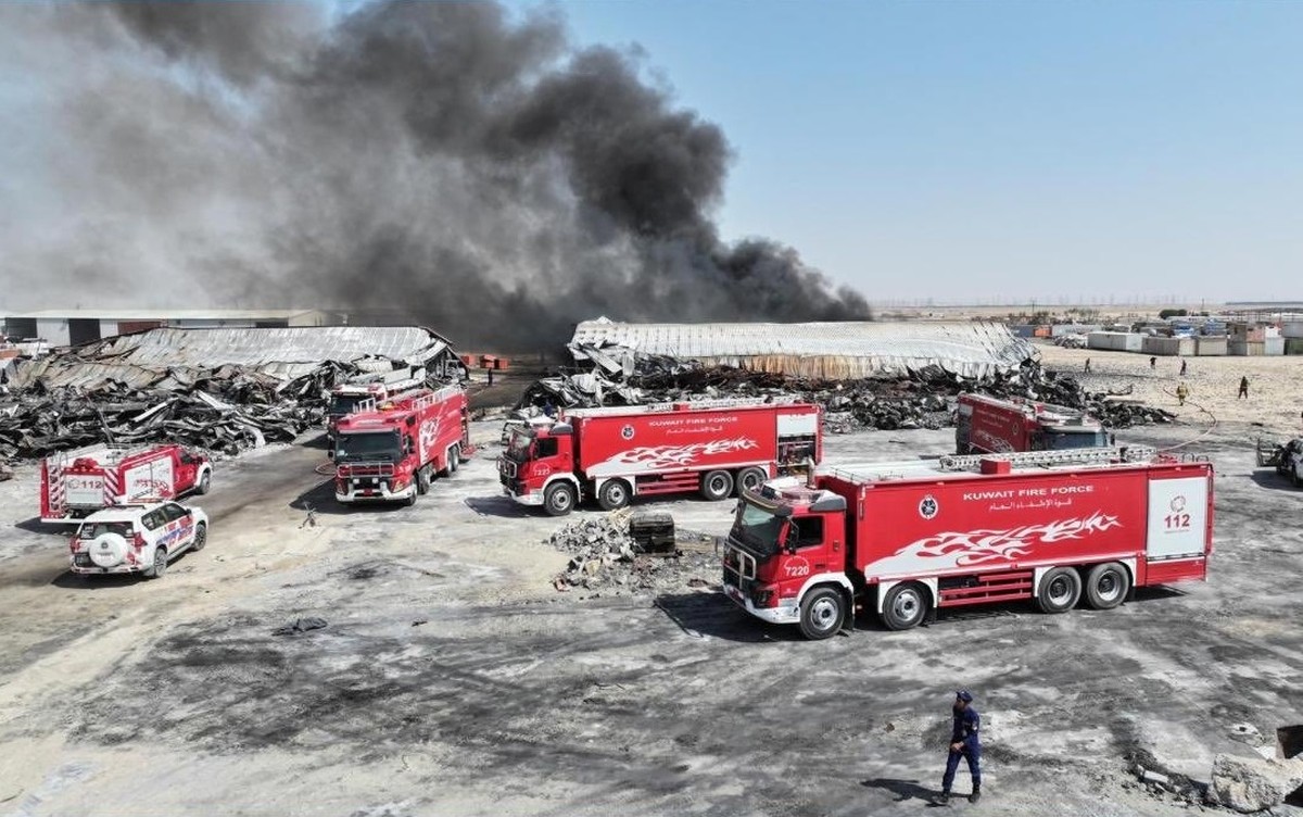 Firefighters contain a major blaze at a warehouse in the Sulaibiya area