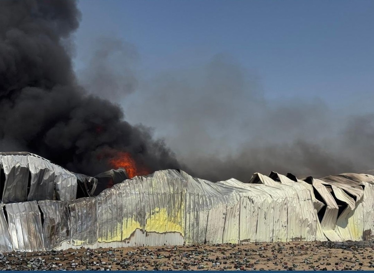 Firefighters contain a major blaze at a warehouse in the Sulaibiya area