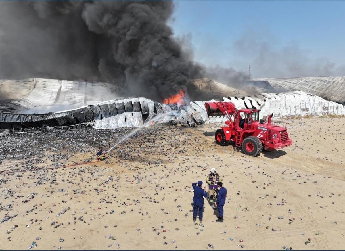 Firefighters contain a major blaze at a warehouse in the Sulaibiya area