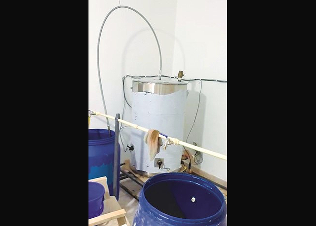 Liquor Bust in Sabah Al-Ahmad: Expat Arrested, 97 Barrels and 450 Bottles Seized