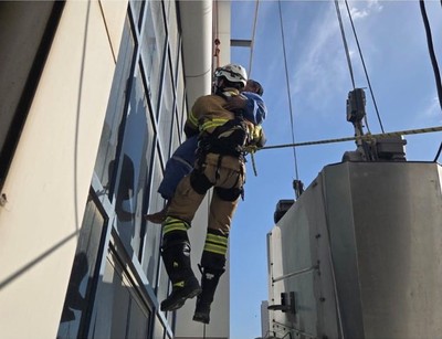 General Fire Force saves a worker trapped in a building crane
