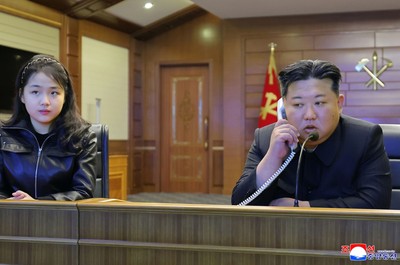 North Korean leader Kim watches cruise missile tests with daughter