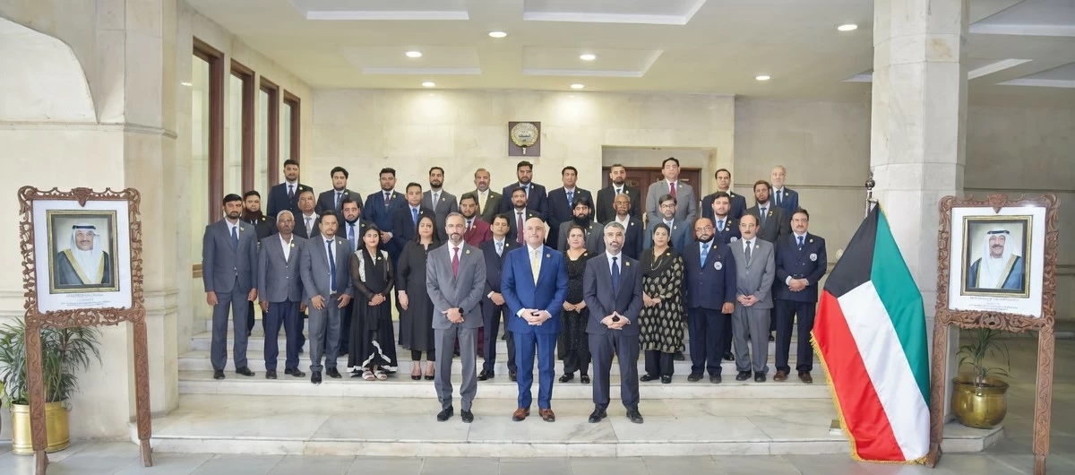 Kuwaiti Ambassador in New Delhi and Embassy staff wear Arfaj flower badge