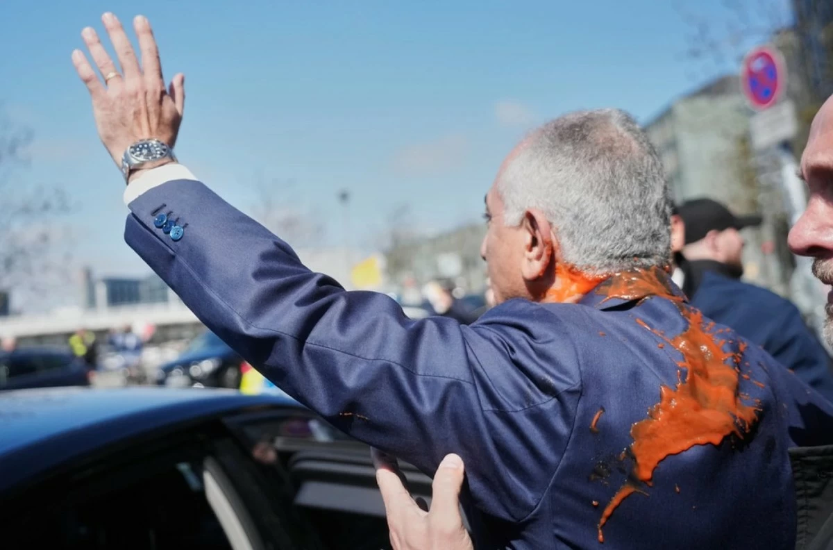 Reza Pahlavi Splashed With Red Liquid After Berlin News Conference