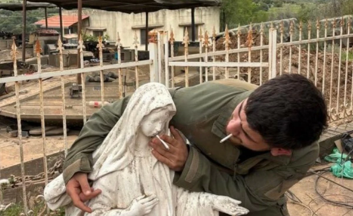 Israeli Soldier Sparks Outrage With Cigarette Photo at Virgin Mary Statue