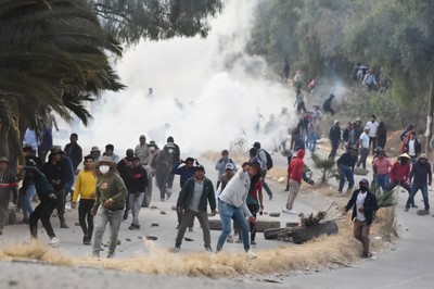 Protesters, police clash in Bolivia after president signs law enabling harsher crackdown