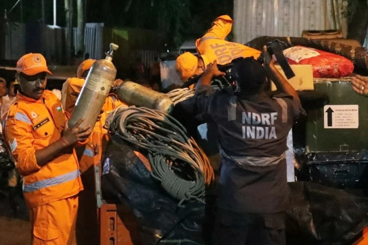 Toxic gas slows efforts to rescue 13 workers trapped in India hydropower tunnel