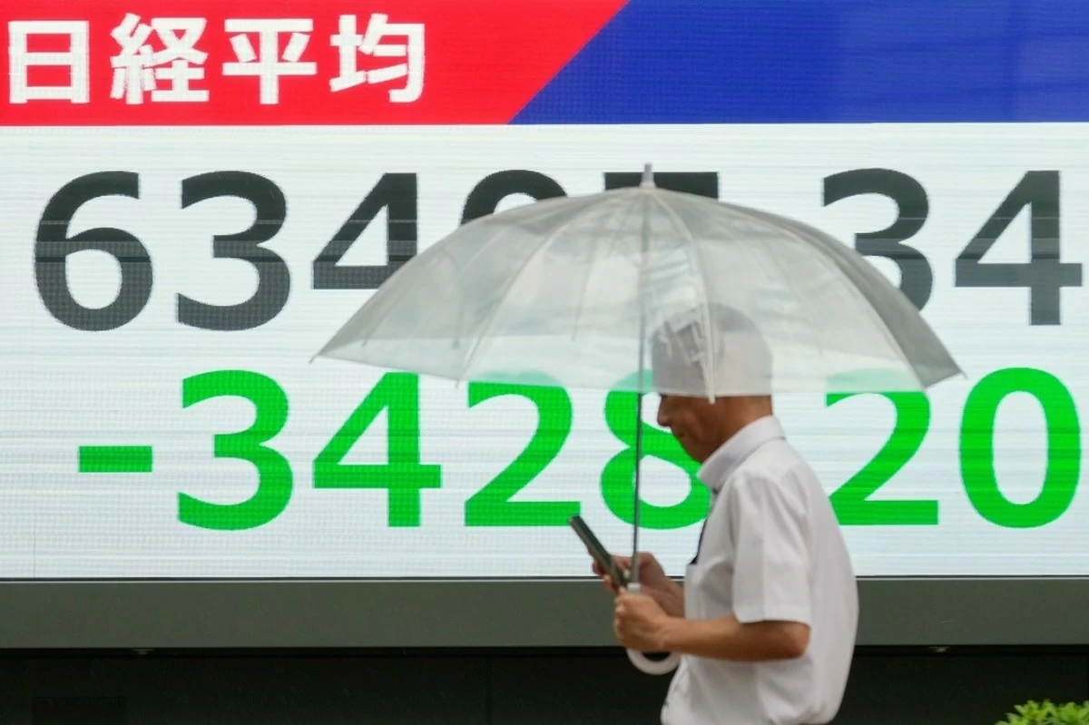 Asian shares mostly higher and Mideast tensions push Brent crude past $96