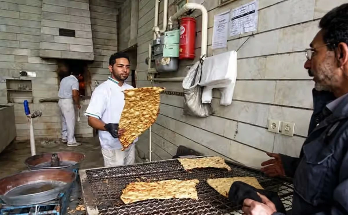 Iranians buy bread on credit, queue for chicken scraps as inflation deepens food crisis