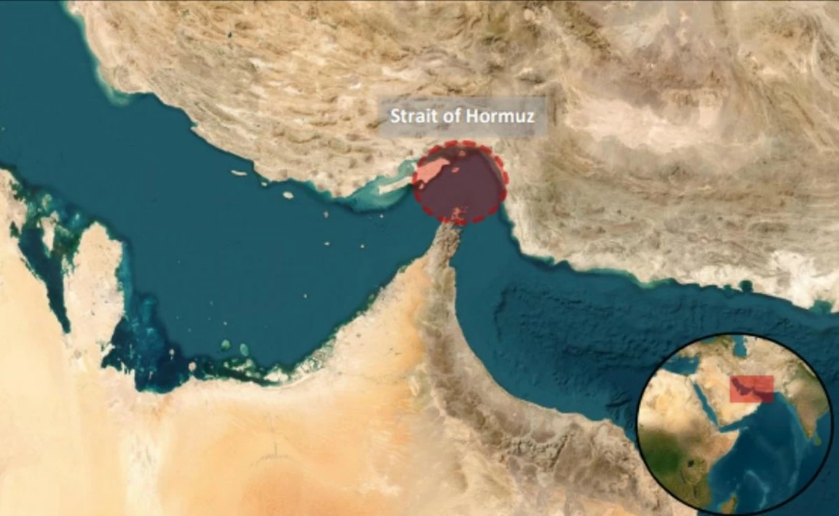 Cargo vessel hit by unknown projectile in Strait of Hormuz; two casualties reported