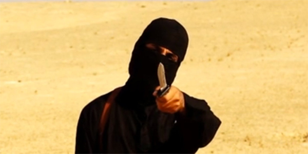 A file image grab purportedly shows a masked militant holding a knife and gesturing as he speaks to the camera in a desert landscape before beheading US freelance writer Steven Sotloff. (AFP)