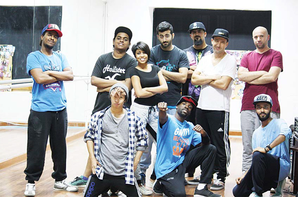 Photo shows Malik Berki (extreme right, standing) with LAPA dancers during a rehearsal for their upcoming performance.