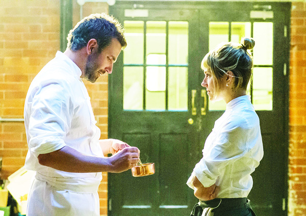 This photo provided by The Weinstein Company shows Bradley Cooper (left), as Adam Jones, and Sienna Miller as Helene, in a scene from the film ‘Burnt’. The movie opens in the US on Oct 30. (AP)
