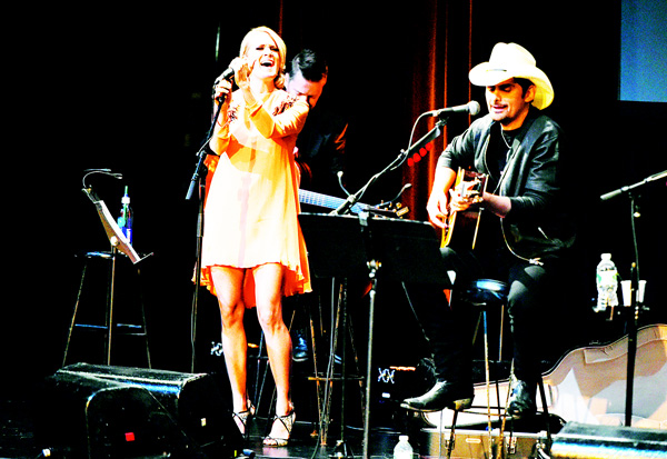 Singer Carrie Underwood (left), and musician Brad Paisley participate in the Country Music Hall of Fame benefit concert at PlayStation Theater on Oct 6, in New York. (AP)