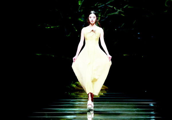 This photo taken on Oct 29 shows a model parading a creation from the 95 Secret Deng Zhaoping Collection designed by Deng Zhaoping at China Fashion Week in Beijing. (AFP)