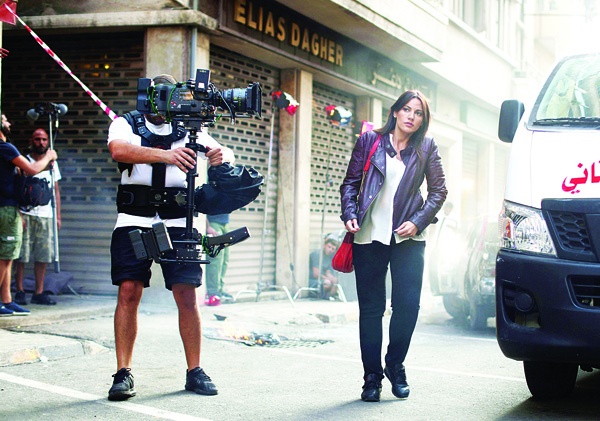 Lebanese actress Darine Hamze is seen on the set of a new movie titled ‘Nuts’ in Beirut on Oct 10. Nuts is a Lebanese movie produced by Lebanese producer Tarek Sikias. (AFP)