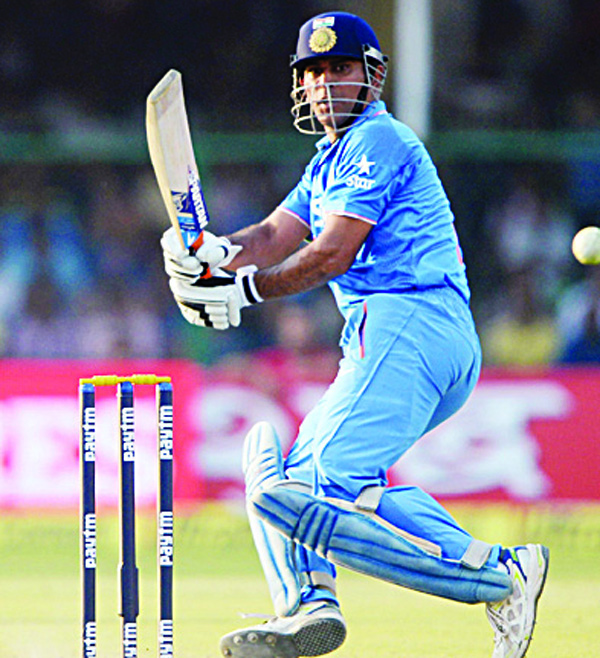 India’s captain Mahendra Singh Dhoni plays a shot during the first One-Day International (ODI) cricket match between India and South Africa at Green Park Stadium in Kanpur on Oct 11. (AFP)