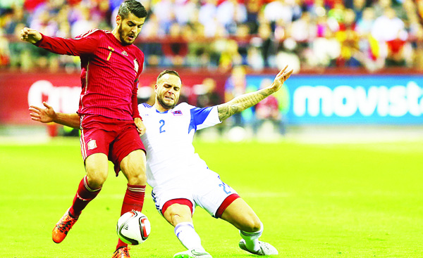 Spain’s forward Alvaro Morata (left), vies with Luxembourg’s defender Maxime Chanot during the Euro 2016 qualifying football match Spain vs Luxembourg at Las Gaunas stadium in Logrono on Oct 9.