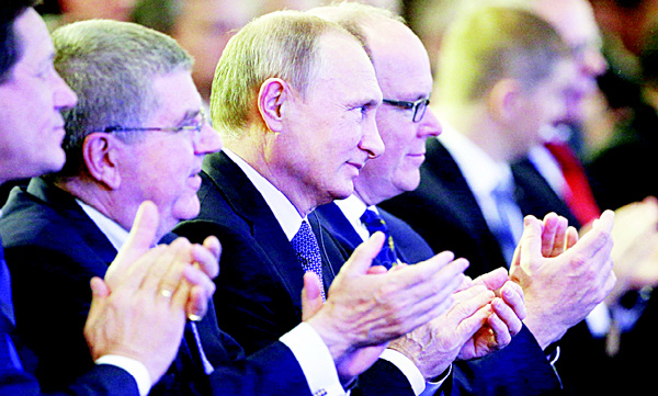 From left: Russia’s Olympic Committee President Alexander Zhukov, International Olympic Committee (IOC) President Thomas Bach, Russian President Vladimir Putin and Prince’s Albert II of Monaco attend the World Olympians Forum in Moscow on Oct 21. (AFP)