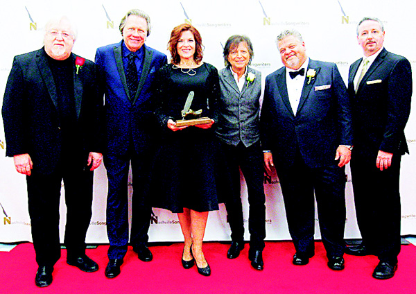 Pat Alger, Board Chair of the Nashville Songwriters Hall of Fame Foundation (left), is seen with Mark James, Even Stevens, Rosanne Cash, Craig Wiseman and Mark Ford, Executive Director of the Nashville Songwriters Hall of Fame Foundation at The Nashville Songwriters Hall of Fame Dinner and Induction Ceremony at the Music City Center on Sunday, Oct 11, in Nashville, Tenn. (AP)