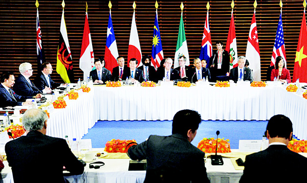 This file photo taken on Nov 10, 2014 shows US President Barack Obama (3rd right) taking part in a meeting with leaders from the Trans-Pacific Partnership (TPP) at the US Embassy in Beijing on the sidelines of the 2014 APEC Summit. Japan’s Prime Minister said on Oct 5, that a dozen nations have reached ‘broad agreement’ on the Trans-Pacific Partnership, which aims to become the world’s largest free-trade zone, after days of talks. (AFP)
