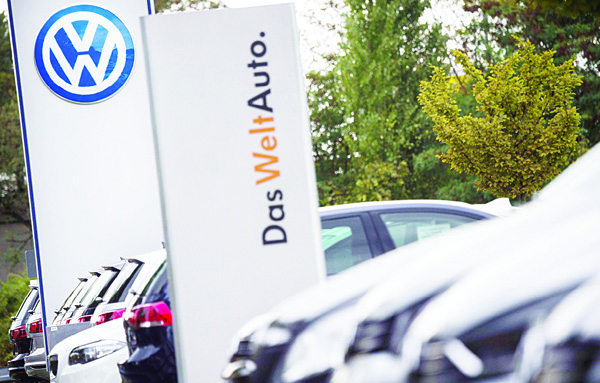 This file photo shows the German car maker Volkswagen logo at a VW dealer in Berlin. The German transport authorities plan to order auto giant Volkswagen to recall 2.4 million diesel vehicles in Germany that are equipped with pollution-cheating software, a spokesman told AFP on Oct 15. (AFP)