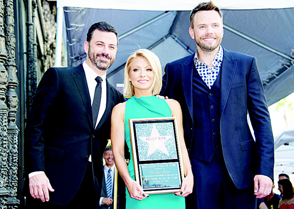 Left to right: Jimmy Kimmel, Kelly Ripa and Joel McHale attend the ceremony honoring Kelly Ripa with a star on Hollywood Walk of Fame in Los Angeles, California, on Oct 12. (AFP)
