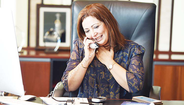 President of the Tunisian employers union (UTICA) Wided Bouchamaoui, speaks on the phone in her office in Tunis on Oct 9, after she was awarded the 2015 Nobel Peace Prize with other members of Tunisian National Dialogue Quartet. (AFP)