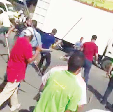 The two groups used sticks during fight.