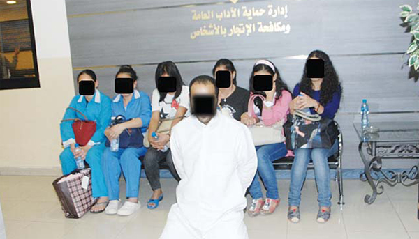 The alleged human trafficker and women found in his detention