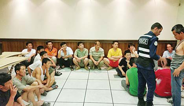 The Asian expats in police custody.