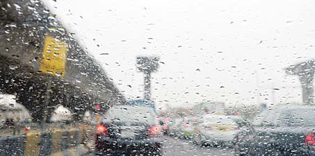 Kuwait witnessed torrential rains Wednesday leading to flooding in some areas. Photo above shows vehicles moving in the rain