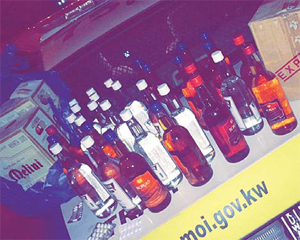 The liquor bottles and narcotic pills seized from the man
