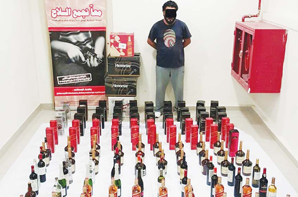The alleged suspect and liquor found in his possession