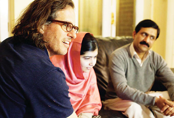 In this Dec 17, 2013 photo released by Twentieth Century Fox Film Corporation, director Davis Guggenheim appears in Birmingham, England with Malala Yousafzai, and Ziauddinuddin Yousafzai during the filming of the documentary, ‘He Named Me Malala’, released in US theaters on Friday. (AP)