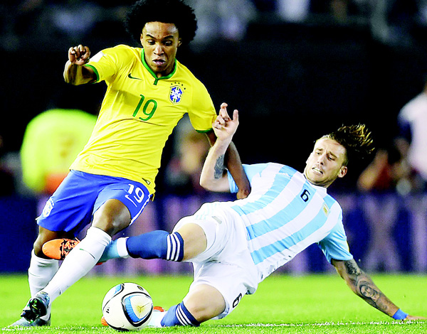 Brazil’s Willian and Argentina’s Lucas Biglia vies for the ball during their Russia 2018 FIFA World Cup South American Qualifiers football match in Buenos Aires on Nov 13. (AFP)