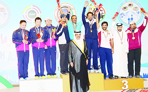 Some of the winners display their medals on the podium after the awarding ceremony