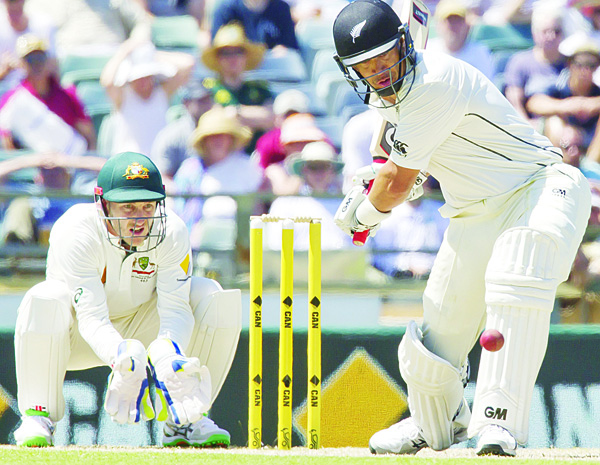 New Zealand’s batsman Ross Taylor (right), plays a shot watched by Australia’s wicketkeeper Peter Nevill during day three of the second Test cricket match between Australia and New Zealand in Perth on Nov 15. (AFP)