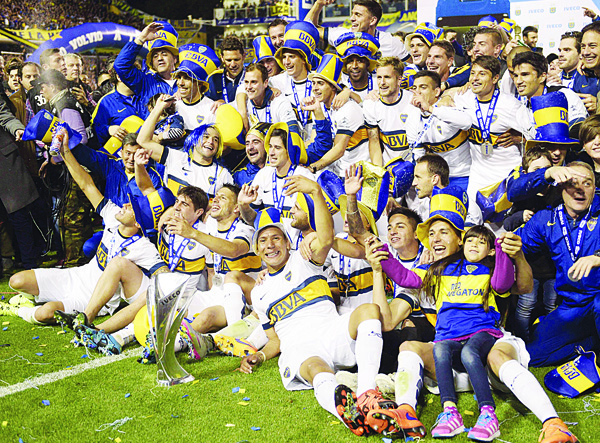 Boca Juniors’ footballers pose for pictures after winning Argentina’s first division football championship at the ‘La Bombonera’ Stadium in Buenos Aires on Nov 1. (AFP)