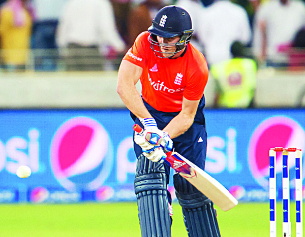 England’s David Willey plays a shot during the second T20 cricket match between Pakistan and England at the Dubai International Cricket Stadium in Dubai on Nov 27. (AFP)