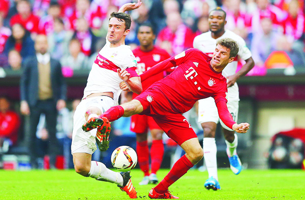 Bayern’s Thomas Mueller (right), Stuttgart’s Christian Gentner challenge for the ball during the German Bundesliga soccer match between FC Bayern Munich and VfB Stuttgart in Munich, Germany on Nov 7. (AP)