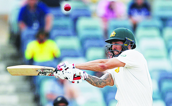 Australia’s Mitchell Johnson plays a shot on the final day of the second cricket Test match between Australia and New Zealand in Perth on Nov 17. (AFP)