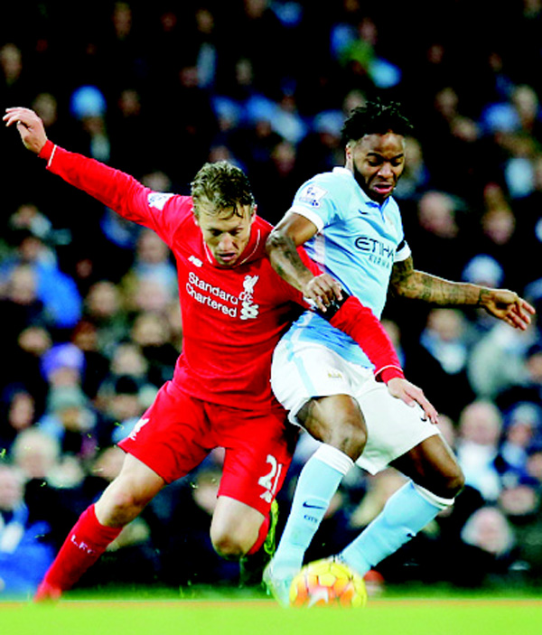 Manchester City’s Raheem Sterling (right), is challenged by Liverpool’s Lucas Leiva during the English Premier League soccer match between Manchester City and Liverpool at the Etihad Stadium, Manchester, England on Nov 21. (AP)