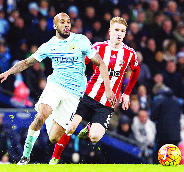 Manchester City’s English midfielder Fabian Delph (left), vies with Southampton’s Northern Irish midfielder Steven Davis during the English Premier League football match between Manchester City and Southampton at The Etihad stadium in Manchester, north west England on Nov 28. (AFP)