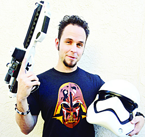 Star Wars fan Michael Bender poses with the latest Stormtrooper gear at his home in Pasadena, California. Bender is anticipating the saga’s latest installment — ‘Star Wars: The Force Awakens’ — that hits screens on Dec 18. (AFP)