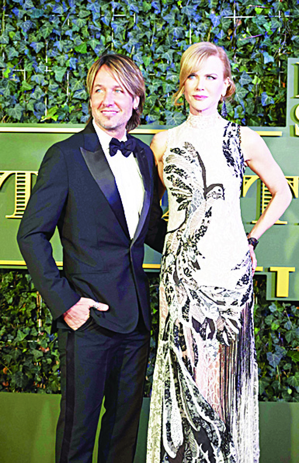 Australian actress Nicole Kidman (right), and her husband musician Keith Urban pose on the red carpet as they arrive to attend the 61st London Evening Standard Theatre Awards at the Old Vic Theatre in London on Nov 22. (AFP)